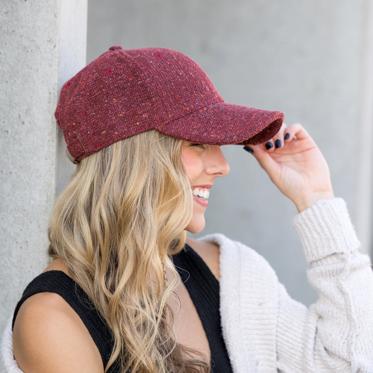 Burgundy tweed-style baseball cap shown from the side.