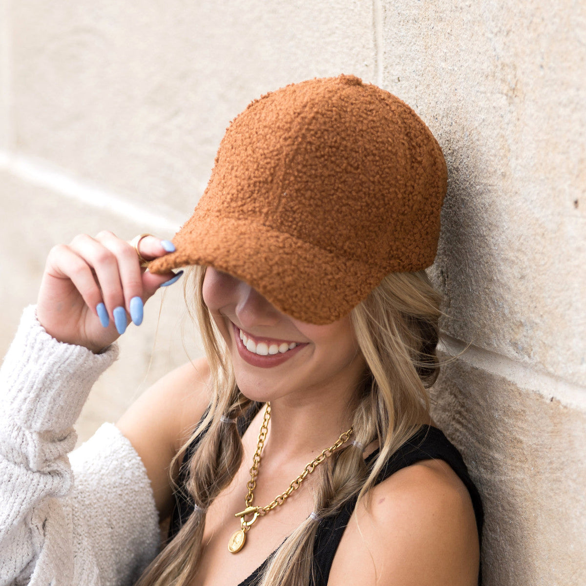 Dark camel textured baseball cap shown from the side.