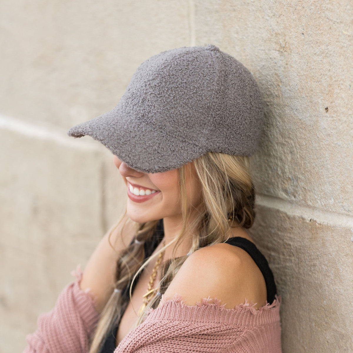 Grey textured baseball cap shown from the side.