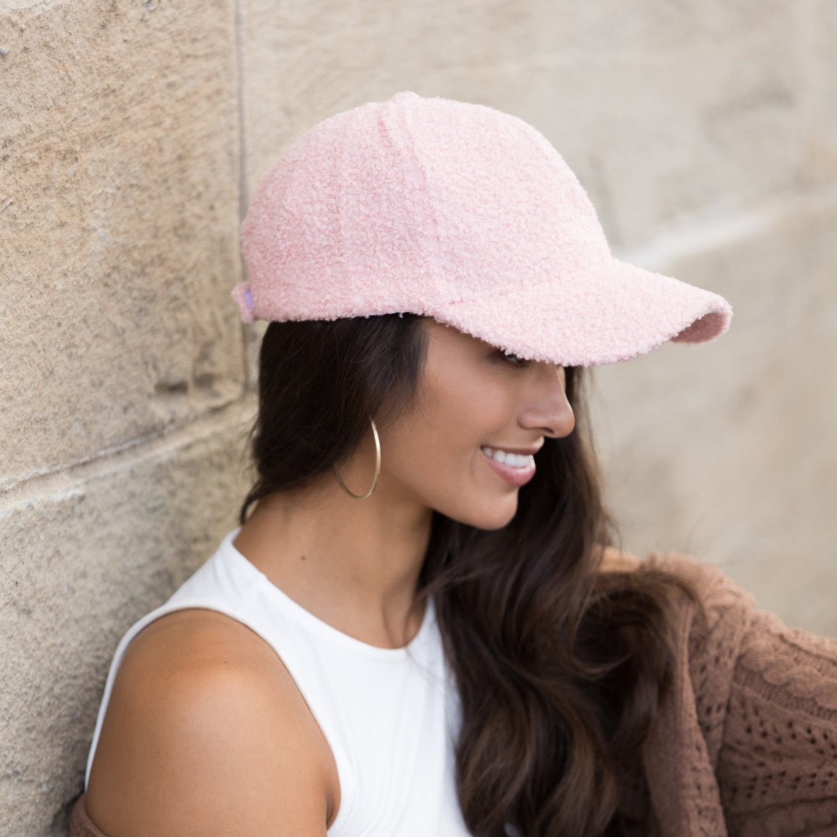Blush pink textured baseball cap shown from the side.