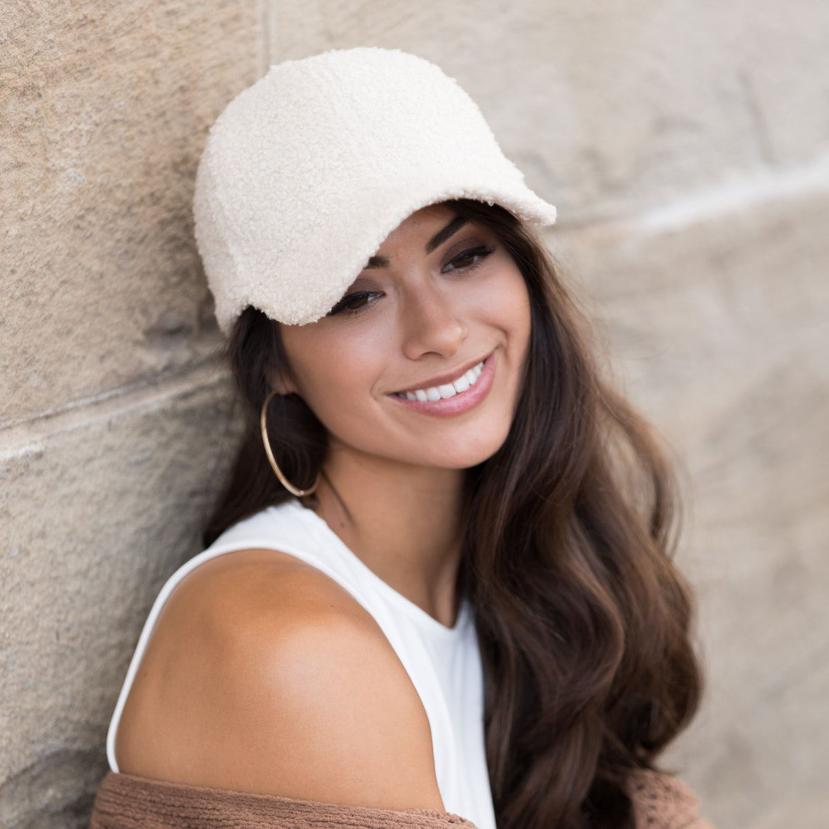 Beige textured baseball cap shown from the front.