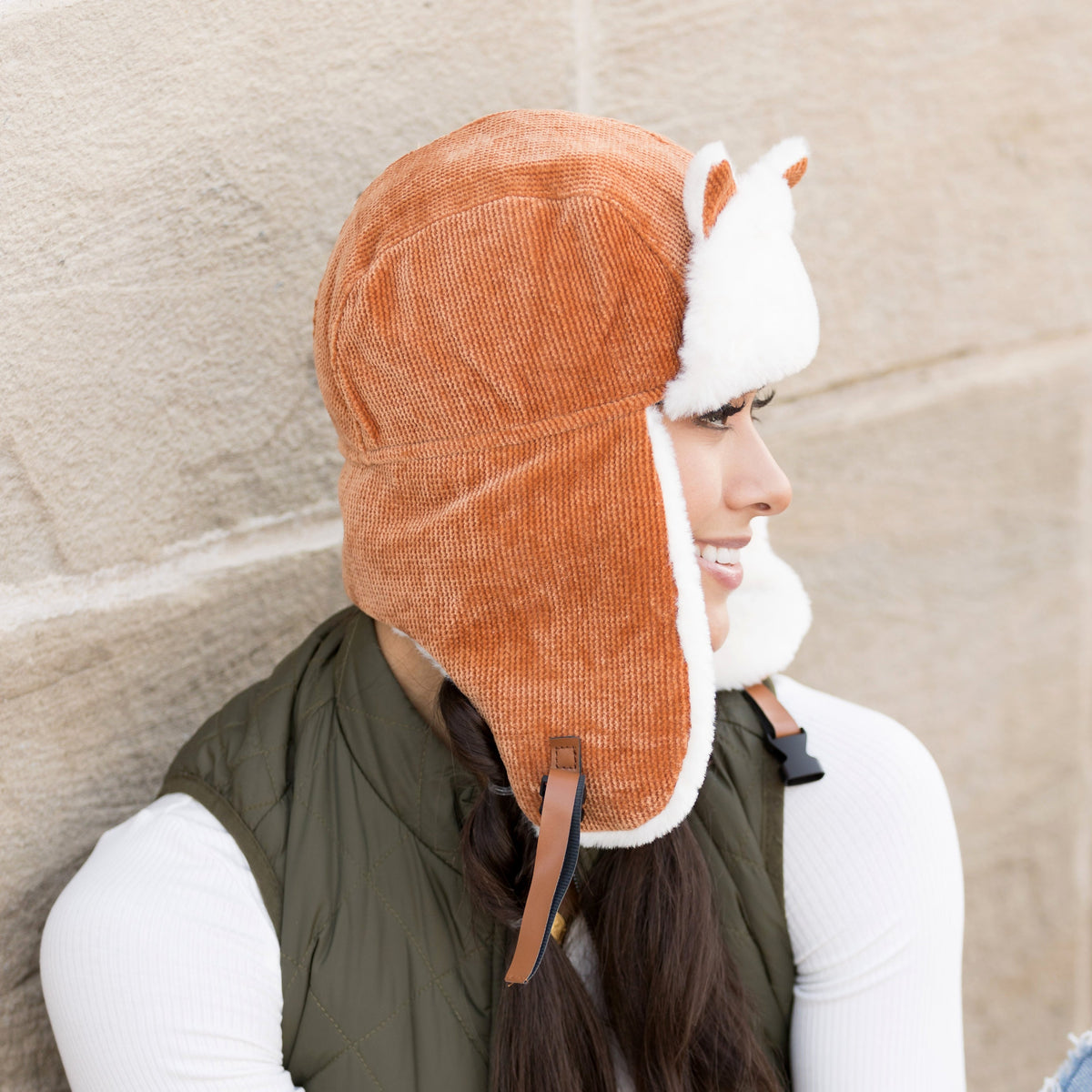 Side view of a camel kitten-ear trapper hat.
