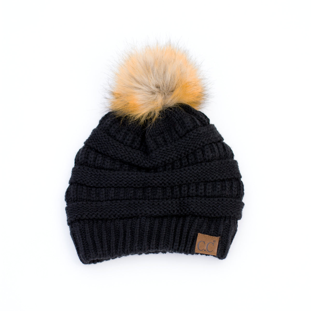 Black knit pom beanie on a white background.
