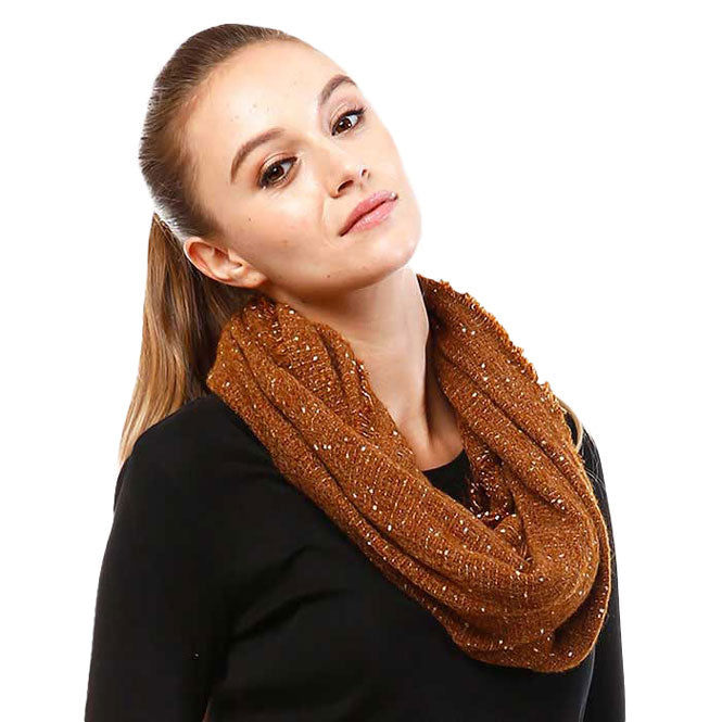 Brown boucle infinity scarf worn with a black top.