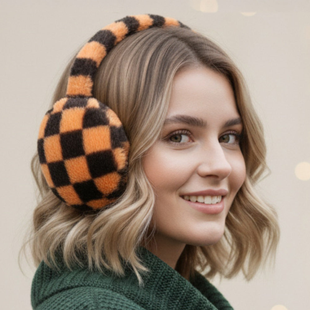 Brown and black checkered plush earmuffs worn on a model.