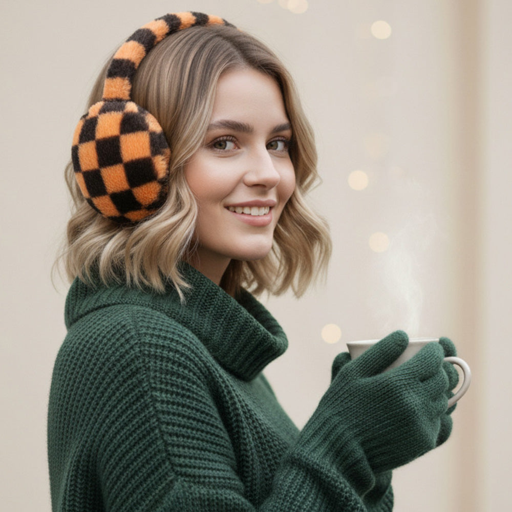 Brown and black checkered earmuffs worn with a green sweater and glove styling props.