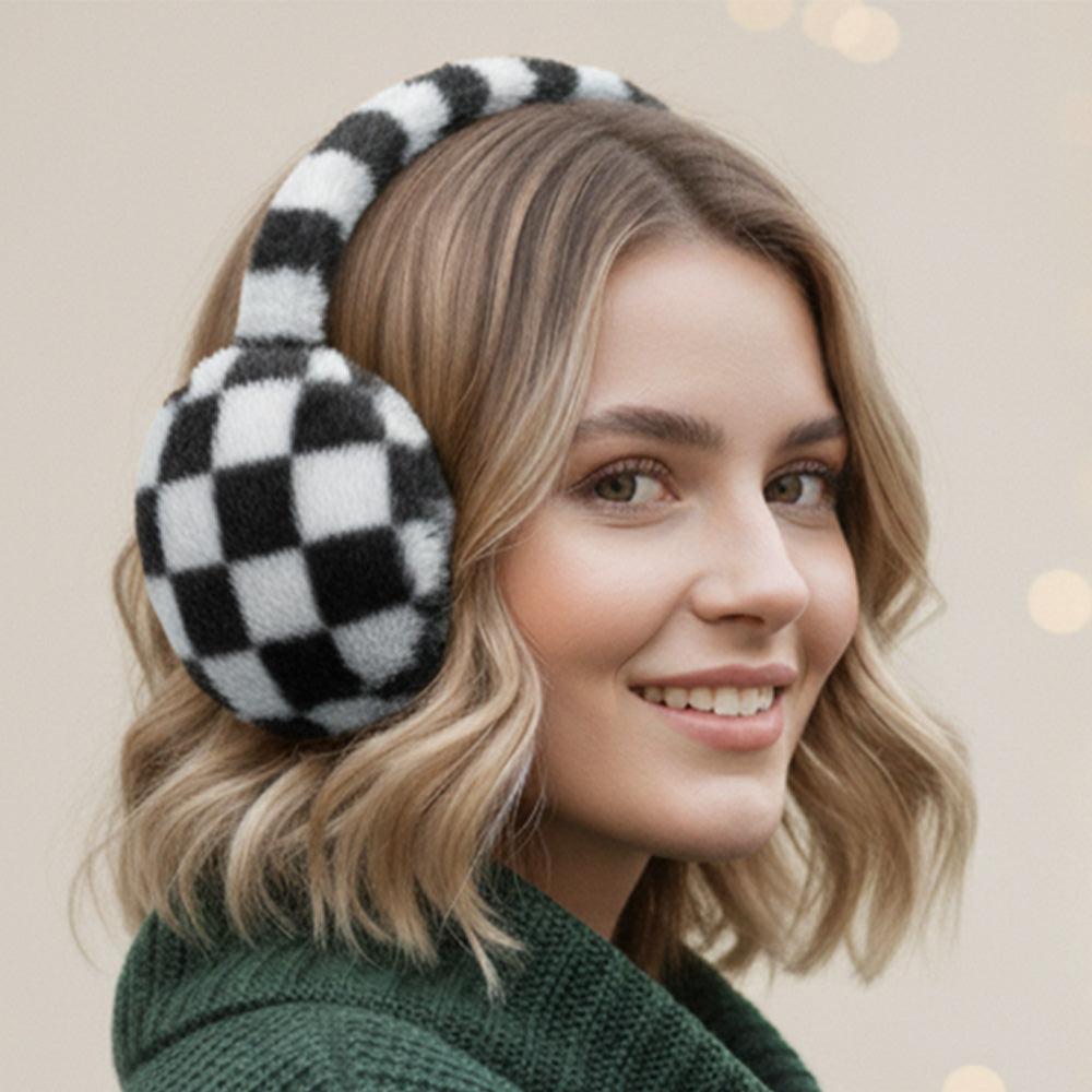 White and black checkered plush earmuffs worn on a model.