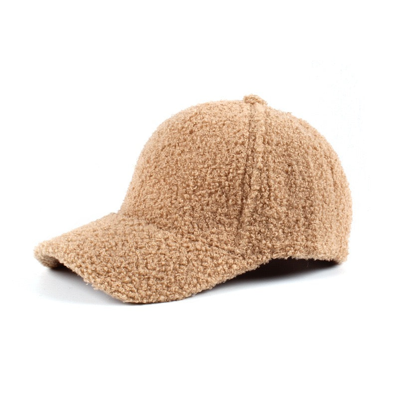 Light camel textured baseball cap on a white background.