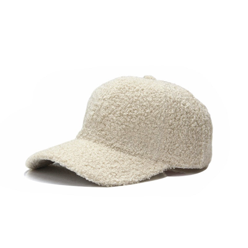 Beige textured baseball cap on a white background.