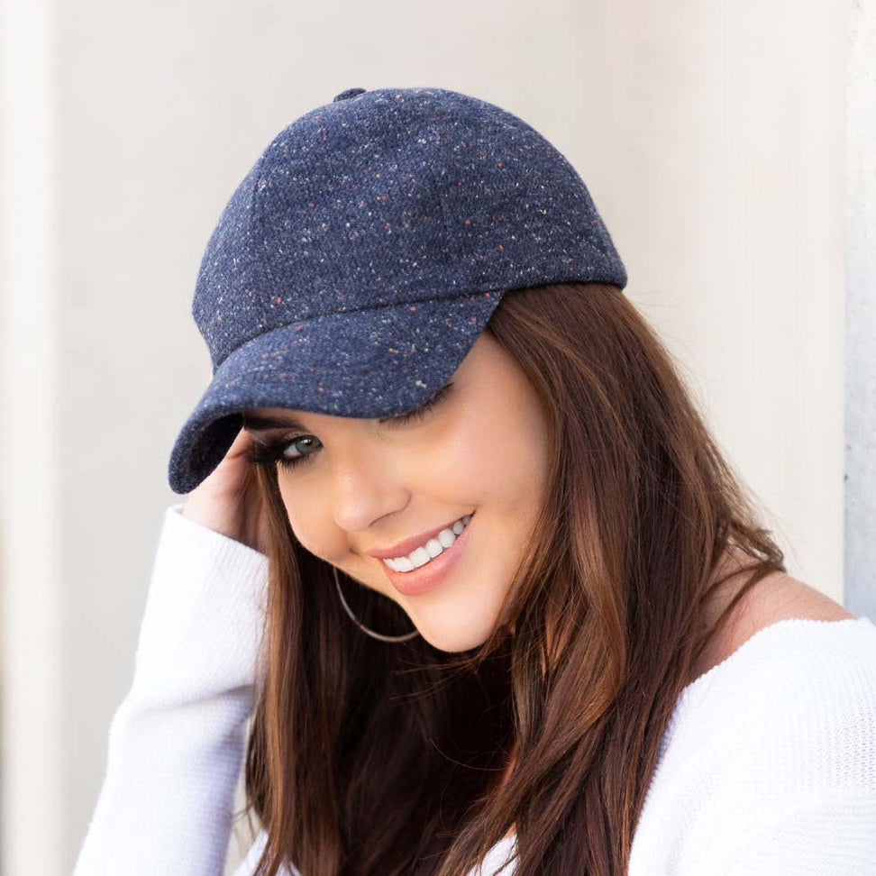 Navy tweed-style baseball cap shown from the side.