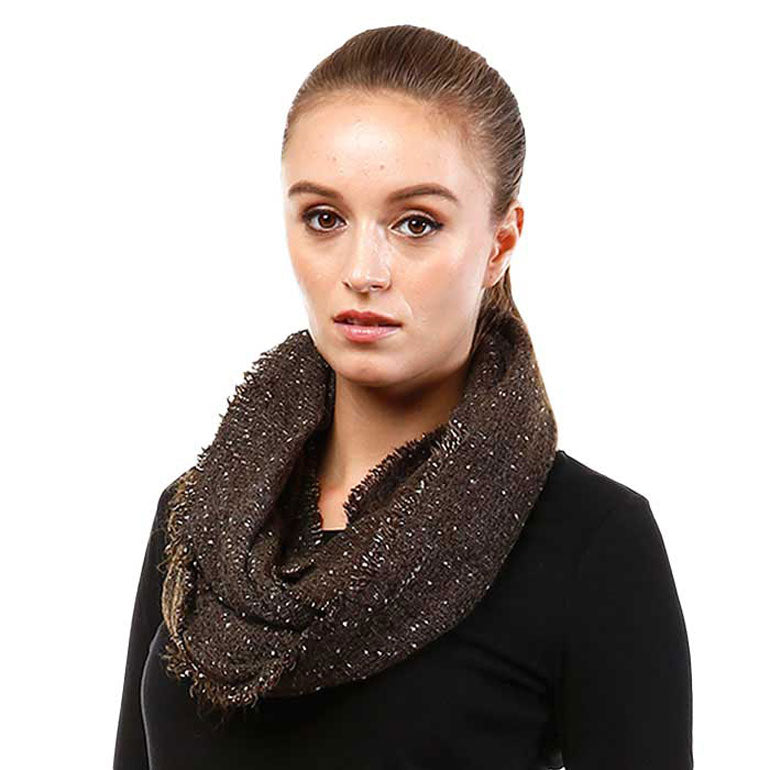 Dark boucle infinity scarf worn with a black top.