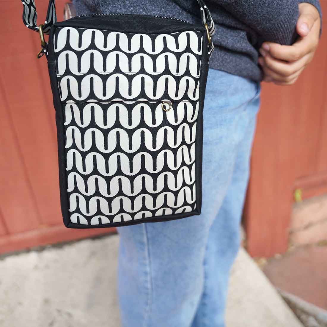 Malia Chunky canvas crossbody bag with black and white geometric print and adjustable strap