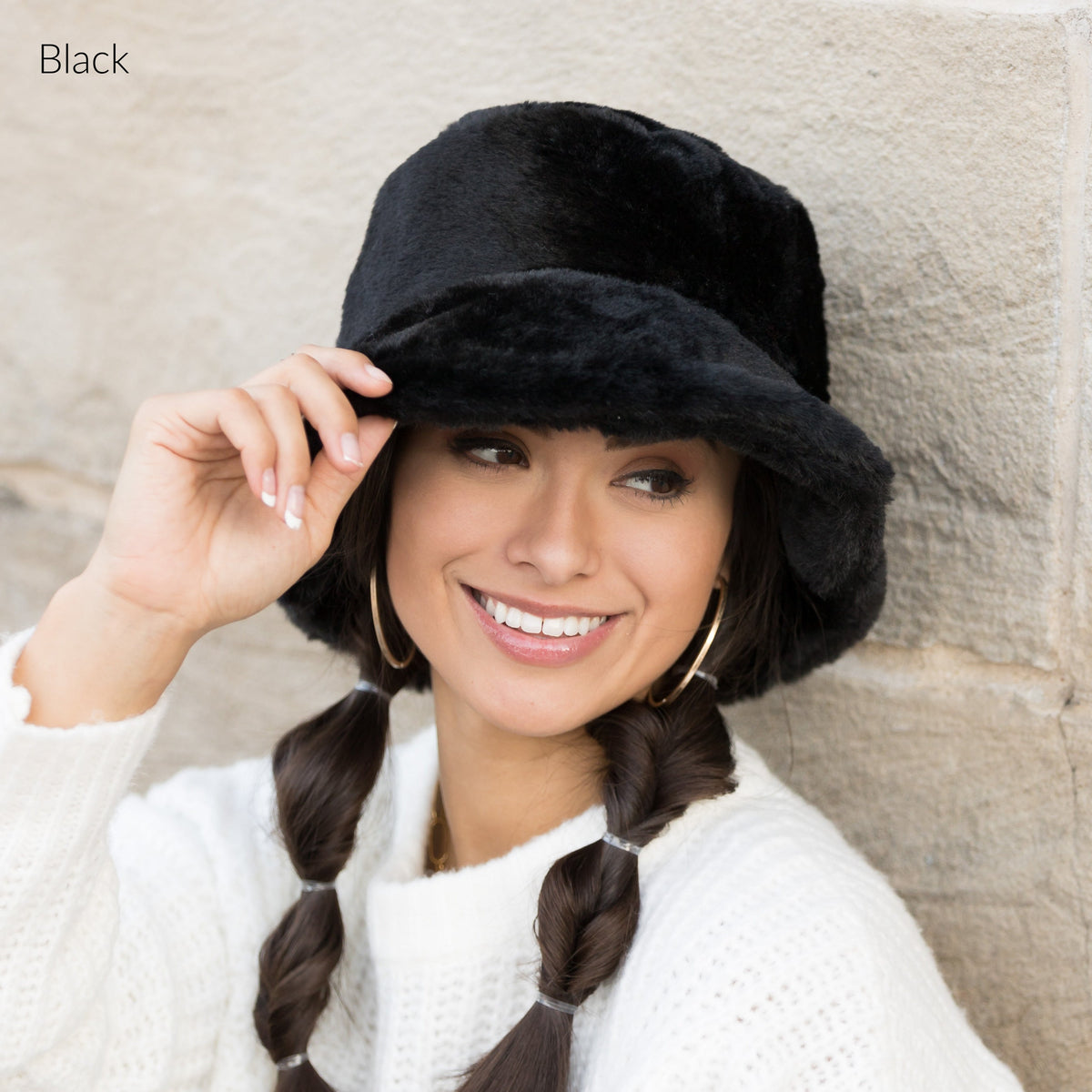 Black plush bucket hat shown from the front.