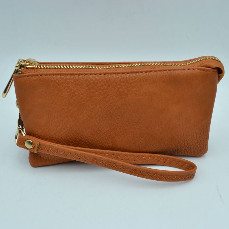Brown pebble-textured wristlet clutch for small essentials