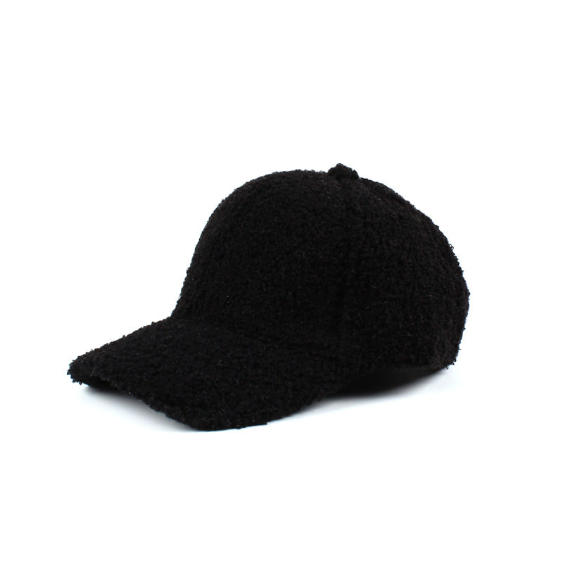 Black textured baseball cap on a white background.