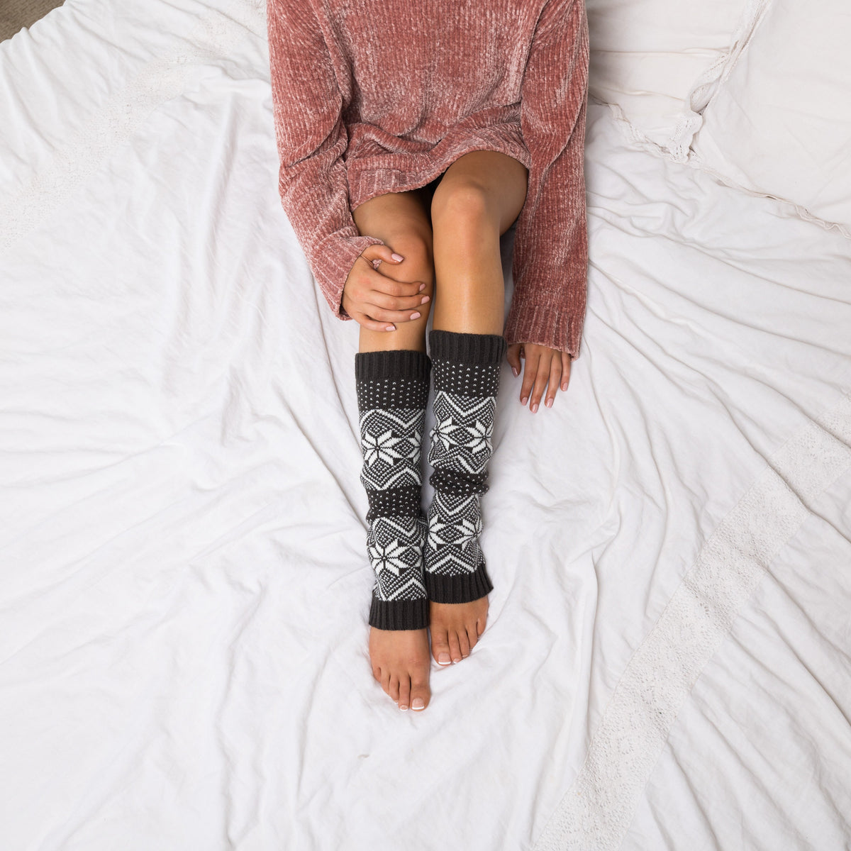 Snowflake-pattern leg warmers shown from above.