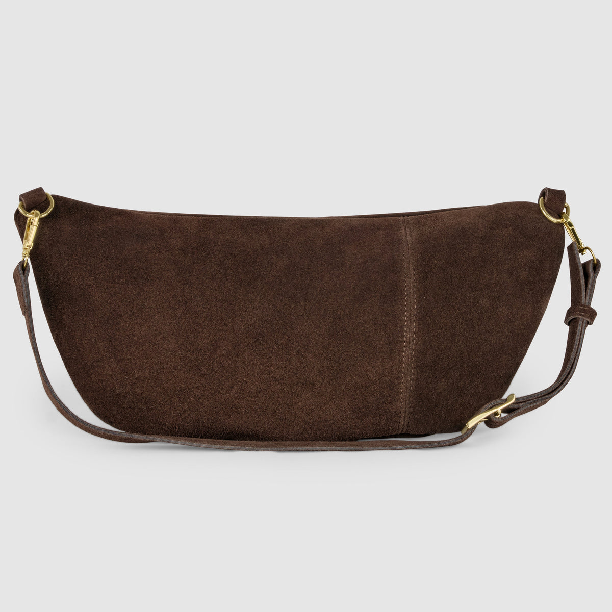 Rear view of the chocolate suede crescent bag showing its curved back panel, strap attachments and adjustable strap.